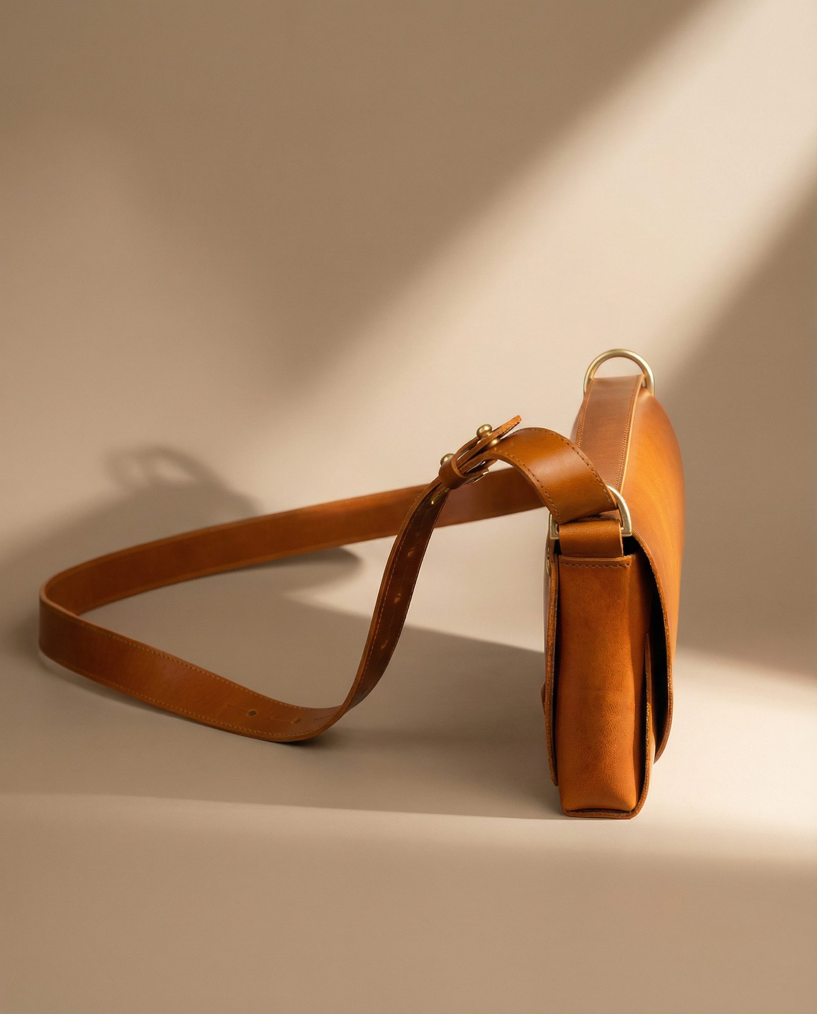 A tan leather shoulder bag